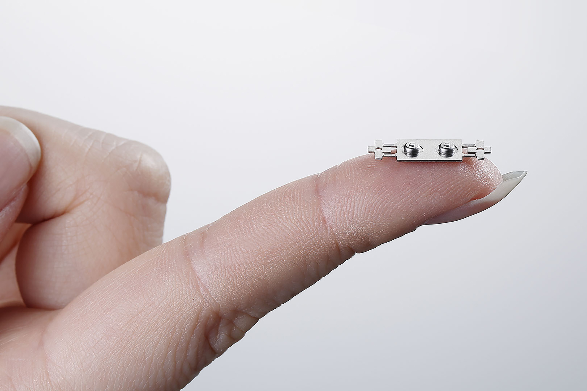 Nano USM technology shown on a finger