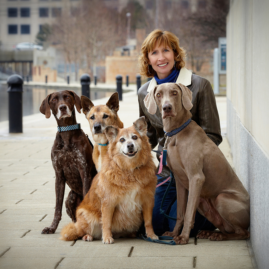 Women with four dogs