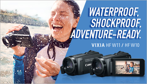A woman enjoying her waterproof VIXIA camcorder in the water
