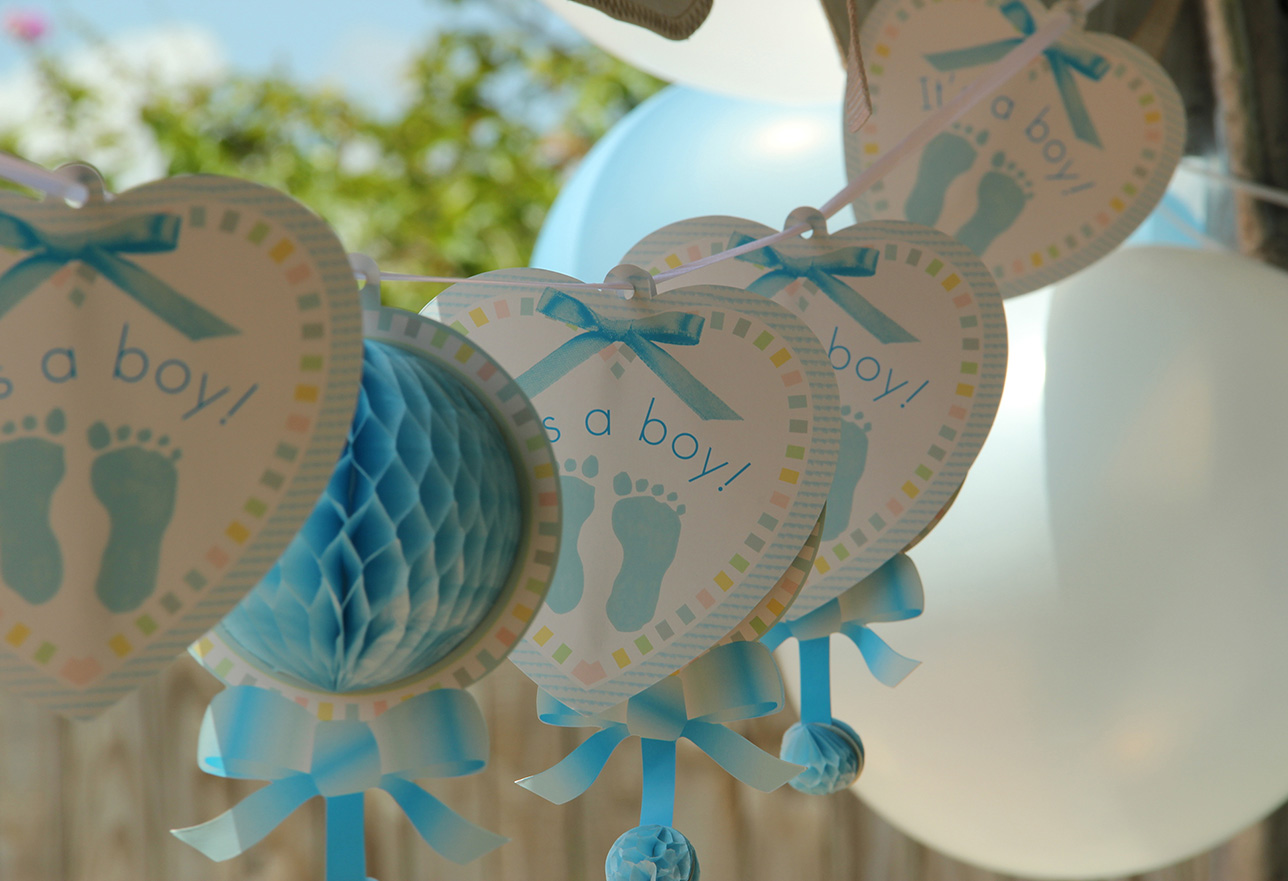String of it's a boy blue heart decorations and balloons